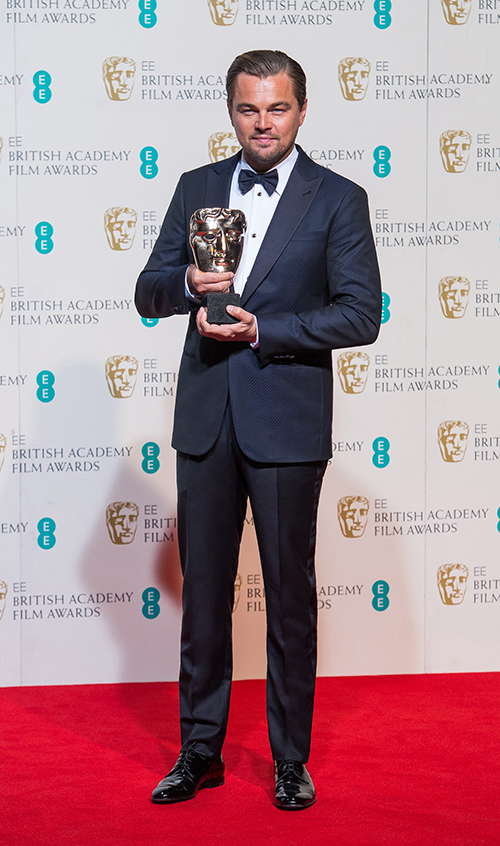 Leonardo DiCaprio at the BAFTA awards in a Giorgio Armani midnight blue tuxedo (Credit: Samir Hussein)